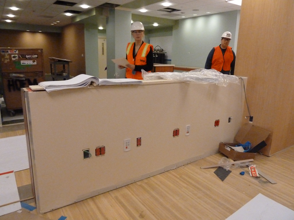 Hospital reception desk being fitted out for a new information system